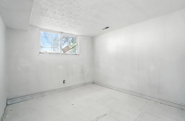 31 S Wheatland Ave, Columbus, OH 43204 - spare room with a textured ceiling and baseboards
