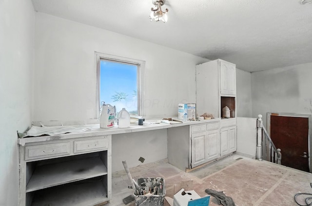 31 S Wheatland Ave, Columbus, OH 43204 - kitchen featuring white cabinetry, an office area, and light countertops