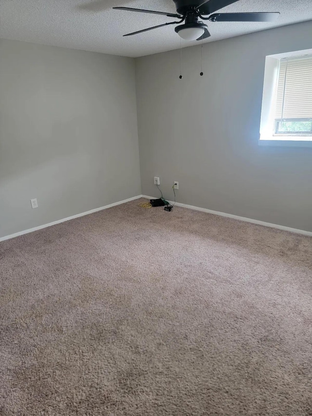 4867 Foxcroft Ct, Columbus, OH 43232 - empty room featuring a ceiling fan, carpet, and a textured ceiling