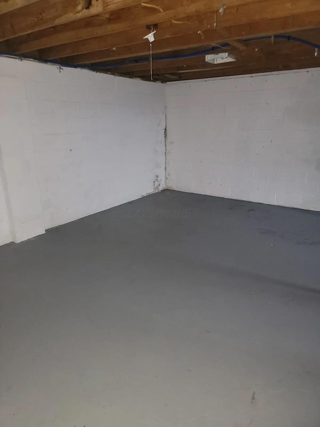 4867 Foxcroft Ct, Columbus, OH 43232 - unfinished basement featuring concrete block wall