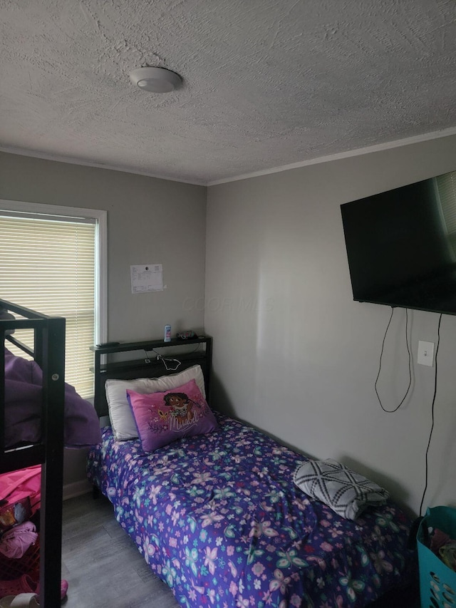 1922 Gault St, Columbus, OH 43205 - bedroom featuring wood finished floors, ornamental molding, and a textured ceiling