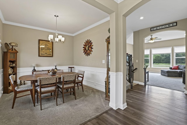 7250 Konold Ct, Canal Winchester, OH 43110 - dining space featuring arched walkways, dark wood finished floors, ceiling fan, a chandelier, and crown molding
