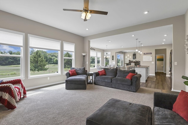 7250 Konold Ct, Canal Winchester, OH 43110 - living area with ceiling fan, recessed lighting, and dark carpet