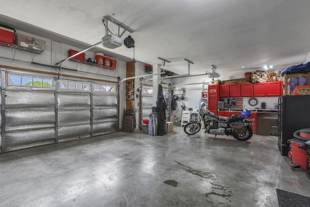 7250 Konold Ct, Canal Winchester, OH 43110 - garage featuring a garage door opener and freestanding refrigerator