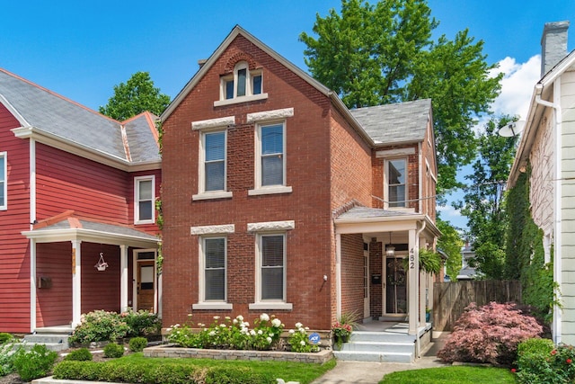482 E Whittier St, Columbus, OH 43206 - view of front of property featuring brick siding and roof with shingles