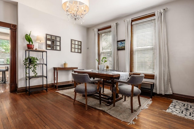 482 E Whittier St, Columbus, OH 43206 - dining area with hardwood / wood-style floors and a chandelier