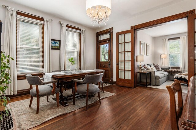 482 E Whittier St, Columbus, OH 43206 - dining space featuring a chandelier, dark wood-style floors, and french doors