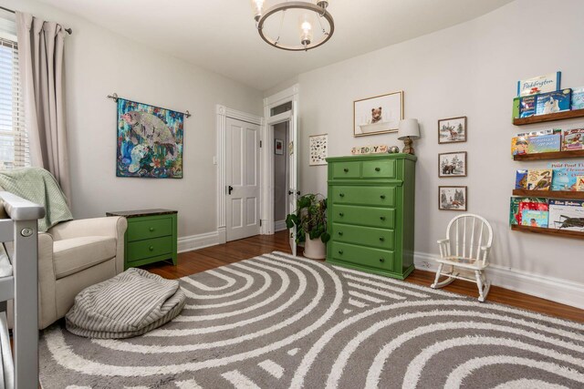 482 E Whittier St, Columbus, OH 43206 - sitting room featuring a chandelier and wood finished floors