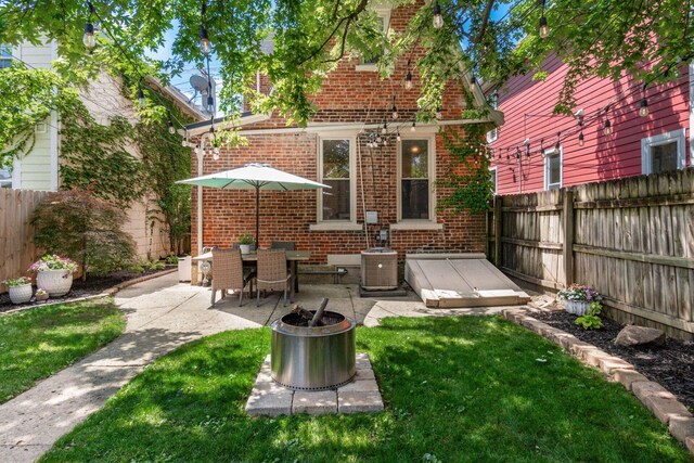482 E Whittier St, Columbus, OH 43206 - fenced backyard with a patio area and a fire pit