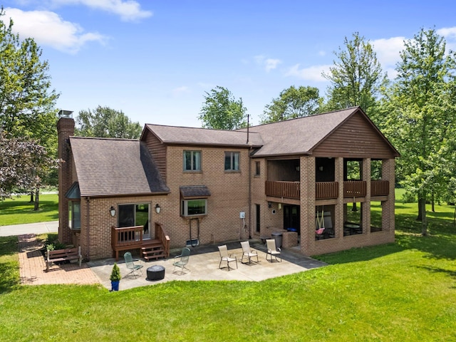 1178 London Rd, West Jefferson, OH 43162 - back of property with a patio, a fire pit, a lawn, and a chimney