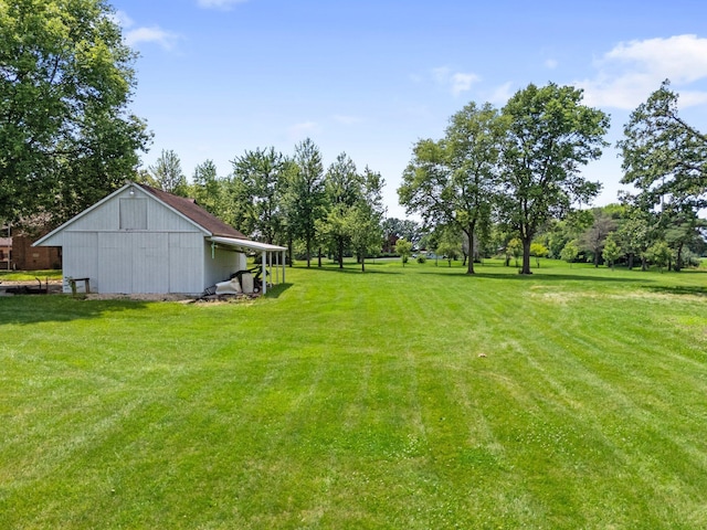 1178 London Rd, West Jefferson, OH 43162 - view of grassy yard with an outbuilding and view of wooded area