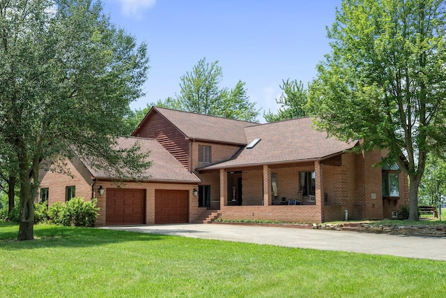 1178 London Rd, West Jefferson, OH 43162 - view of front of property with an attached garage, brick siding, a front lawn, concrete driveway, and roof with shingles