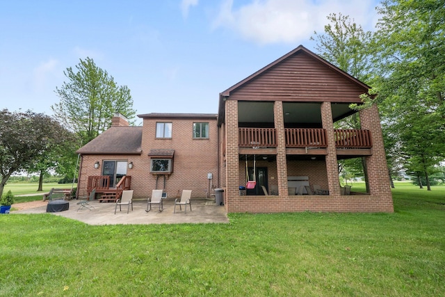 1178 London Rd, West Jefferson, OH 43162 - back of house with a patio, a yard, a chimney, brick siding, and a deck