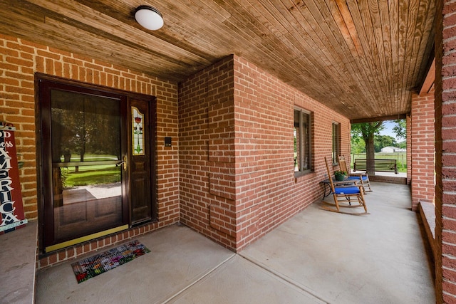 1178 London Rd, West Jefferson, OH 43162 - view of exterior entry featuring covered porch and brick siding
