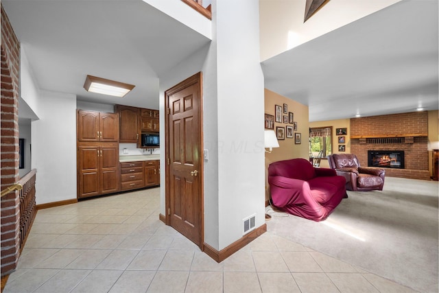 1178 London Rd, West Jefferson, OH 43162 - hallway featuring light tile patterned floors and light carpet