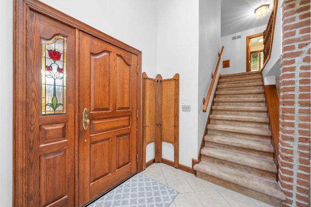 1178 London Rd, West Jefferson, OH 43162 - foyer entrance with light tile patterned floors and stairway