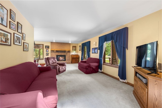 1178 London Rd, West Jefferson, OH 43162 - living room featuring healthy amount of natural light, light carpet, and a fireplace