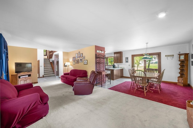 1178 London Rd, West Jefferson, OH 43162 - living area with light carpet and stairs