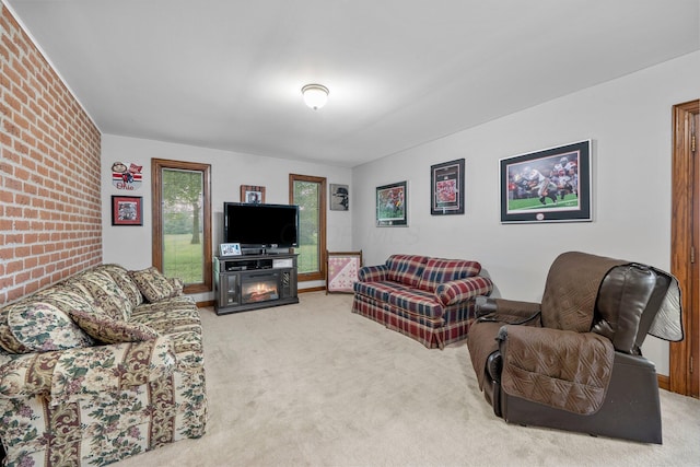 1178 London Rd, West Jefferson, OH 43162 - living room with carpet floors, brick wall, and a fireplace