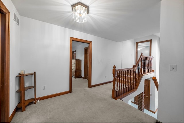 1178 London Rd, West Jefferson, OH 43162 - hall with an upstairs landing, carpet, and a chandelier