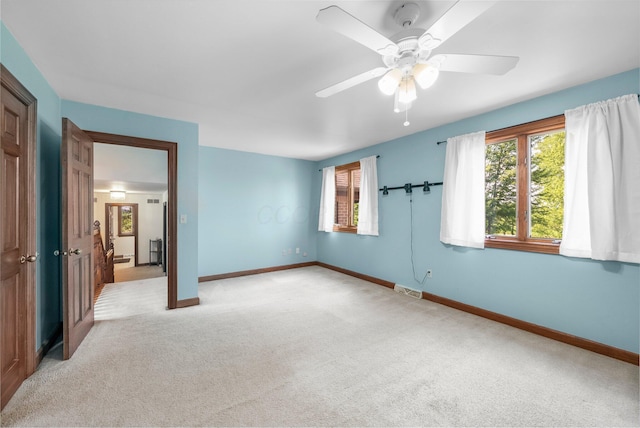 1178 London Rd, West Jefferson, OH 43162 - unfurnished bedroom with light colored carpet and ceiling fan