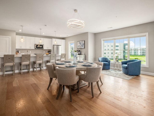 5285 Highpointe Lakes Dr Unit 201, Westerville, OH 43081 - dining space featuring light wood-style floors, a chandelier, and recessed lighting