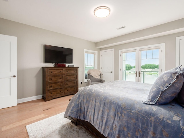 5285 Highpointe Lakes Dr Unit 201, Westerville, OH 43081 - bedroom with access to outside, french doors, and light wood-type flooring
