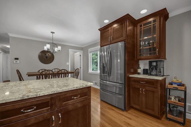 2579 Wickliffe Rd, Columbus, OH 43221 - kitchen featuring stainless steel refrigerator with ice dispenser, light wood-style flooring, ornamental molding, glass insert cabinets, and light stone counters