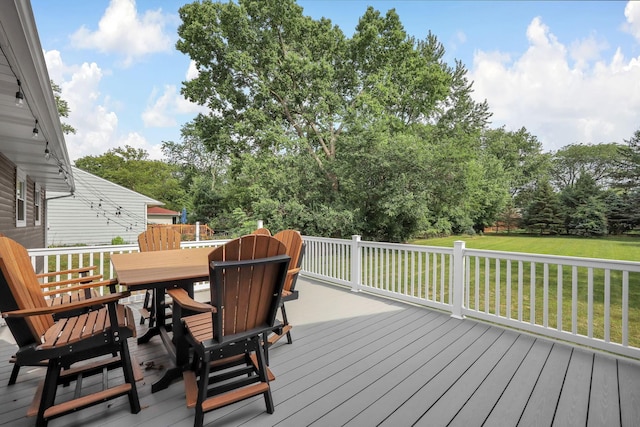 2579 Wickliffe Rd, Columbus, OH 43221 - wooden terrace featuring outdoor dining area, a lawn, and view of scattered trees