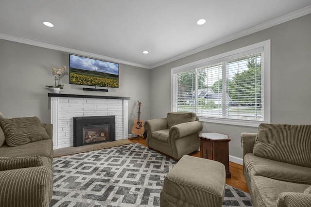 2579 Wickliffe Rd, Columbus, OH 43221 - living room featuring wood finished floors, recessed lighting, crown molding, and a brick fireplace
