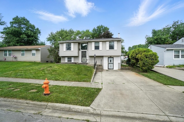 4143 Jonquil St, Columbus, OH 43224 - bi-level home featuring a front yard and concrete driveway