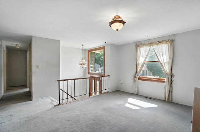 4143 Jonquil St, Columbus, OH 43224 - spare room featuring carpet and a chandelier
