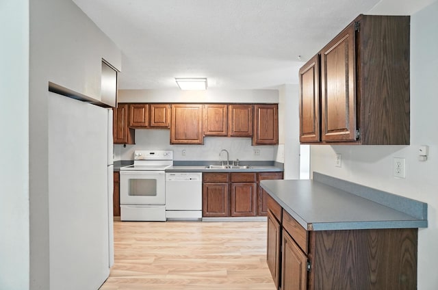 4143 Jonquil St, Columbus, OH 43224 - kitchen with white appliances and light wood-style floors