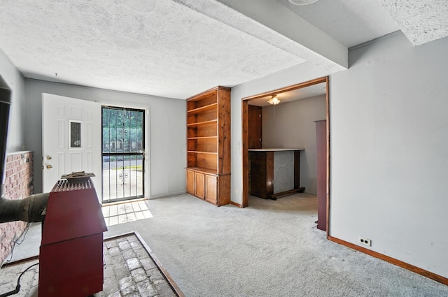 4143 Jonquil St, Columbus, OH 43224 - carpeted living area featuring a textured ceiling and baseboards