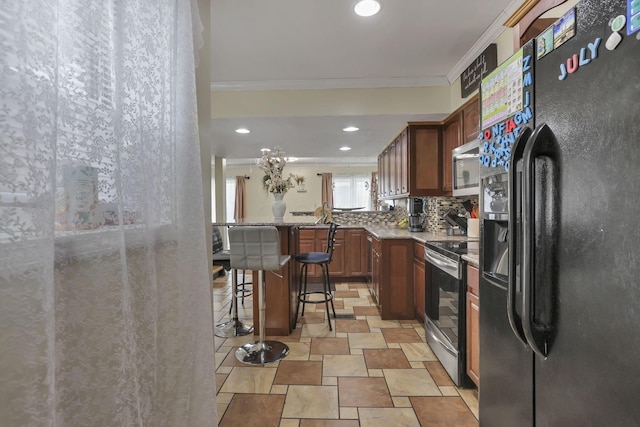 5276 Marci Way, Columbus, OH 43228 - kitchen featuring stainless steel appliances, ornamental molding, decorative backsplash, light stone finish flooring, and recessed lighting