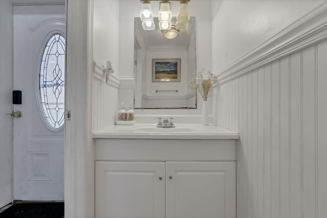 5276 Marci Way, Columbus, OH 43228 - bathroom with vanity, crown molding, a chandelier, and a decorative wall