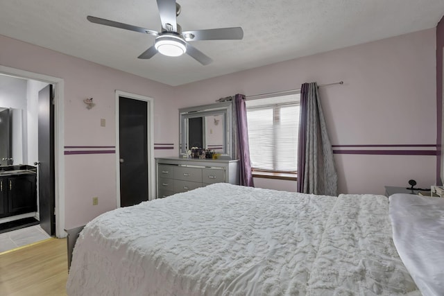 5276 Marci Way, Columbus, OH 43228 - bedroom with light wood-style flooring, a ceiling fan, and ensuite bathroom