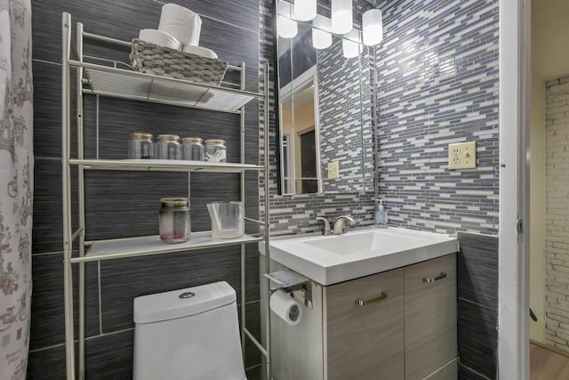 5276 Marci Way, Columbus, OH 43228 - bathroom featuring vanity, decorative backsplash, and tile walls