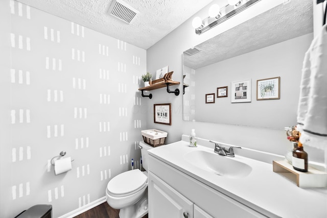 8194 Baltimore Ave Unit 6E, Westerville, OH 43081 - bathroom featuring vanity, a textured ceiling, and wood finished floors
