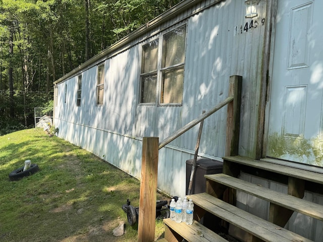 10440 Opossum Hollow Rd, Rockbridge, OH 43149 - view of side of home featuring a lawn and a view of trees