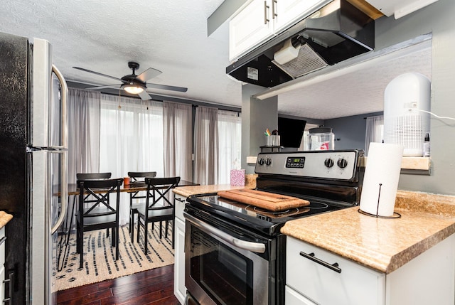 711 Cherry Hollow Rd Unit A, Columbus, OH 43228 - kitchen with appliances with stainless steel finishes, range hood, dark wood-style flooring, a ceiling fan, and white cabinetry