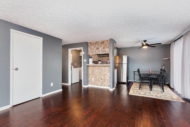 711 Cherry Hollow Rd Unit A, Columbus, OH 43228 - kitchen with freestanding refrigerator, ceiling fan, dark wood finished floors, a textured ceiling, and washing machine and clothes dryer