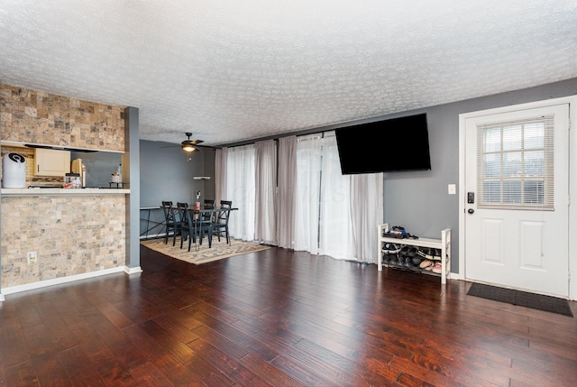 711 Cherry Hollow Rd Unit A, Columbus, OH 43228 - living area with wood finished floors, a textured ceiling, and a ceiling fan