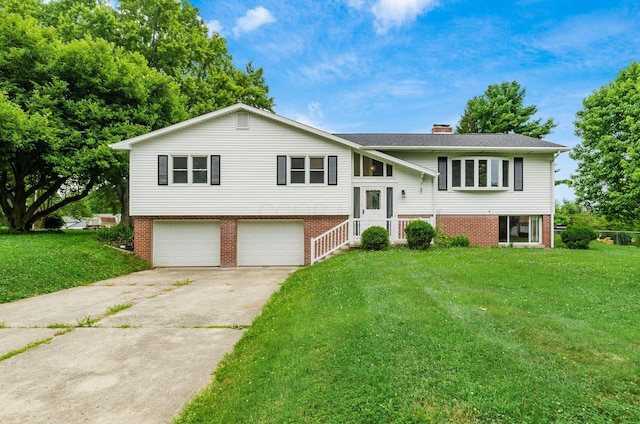 5930 Coonpath Rd NW, Carroll, OH 43112 - bi-level home with a garage, a chimney, concrete driveway, and a front yard