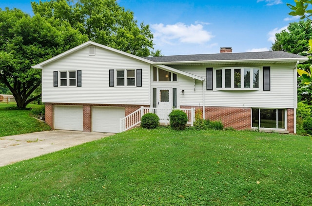 5930 Coonpath Rd NW, Carroll, OH 43112 - split foyer home featuring an attached garage, a front yard, a chimney, concrete driveway, and roof with shingles
