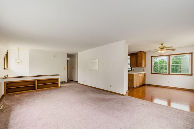5930 Coonpath Rd NW, Carroll, OH 43112 - unfurnished living room featuring light carpet and ceiling fan