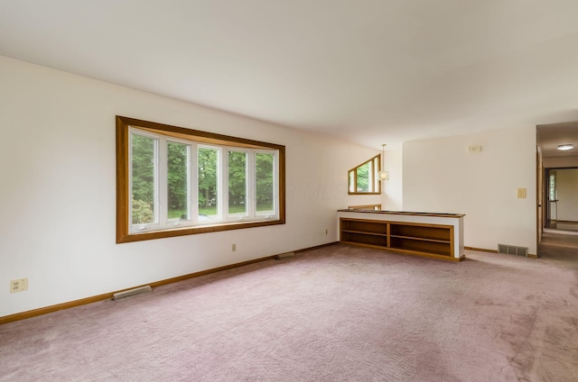 5930 Coonpath Rd NW, Carroll, OH 43112 - unfurnished living room with healthy amount of natural light and carpet
