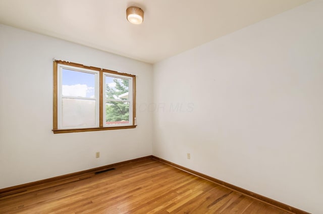 5930 Coonpath Rd NW, Carroll, OH 43112 - spare room featuring baseboards and light wood-style floors