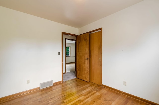 5930 Coonpath Rd NW, Carroll, OH 43112 - spare room with light wood-style flooring and baseboards