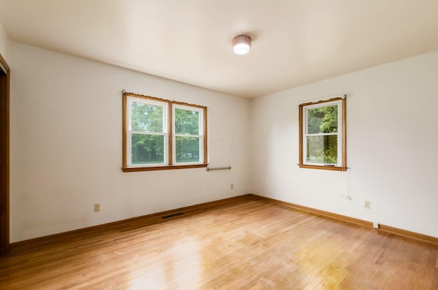 5930 Coonpath Rd NW, Carroll, OH 43112 - unfurnished room featuring plenty of natural light and light wood-type flooring